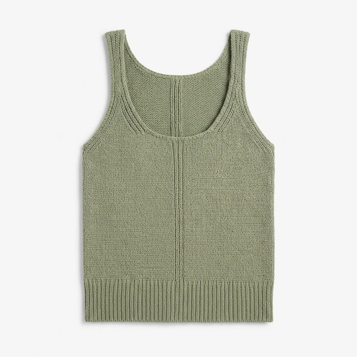 Green knitted tank top on a white background