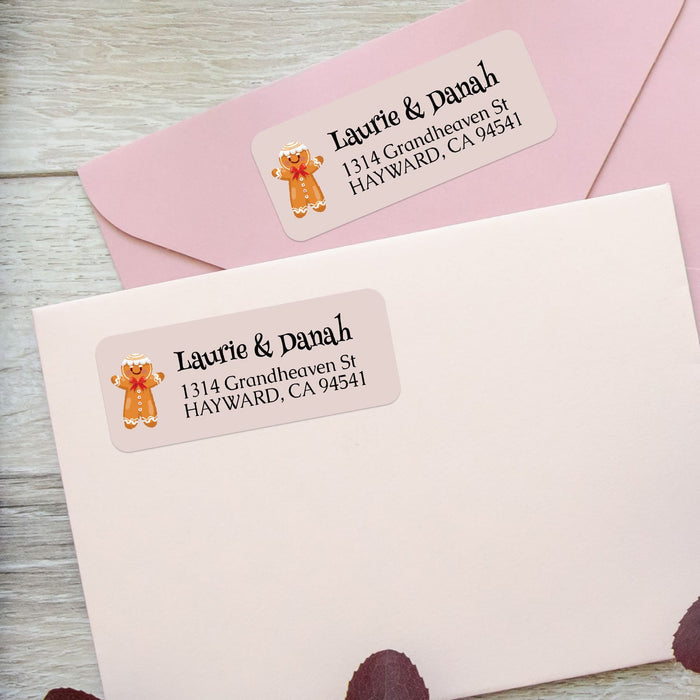 Close-up of gingerbread man return address label with playful holiday design and classic black font, printed on beige background - XOXOKristen