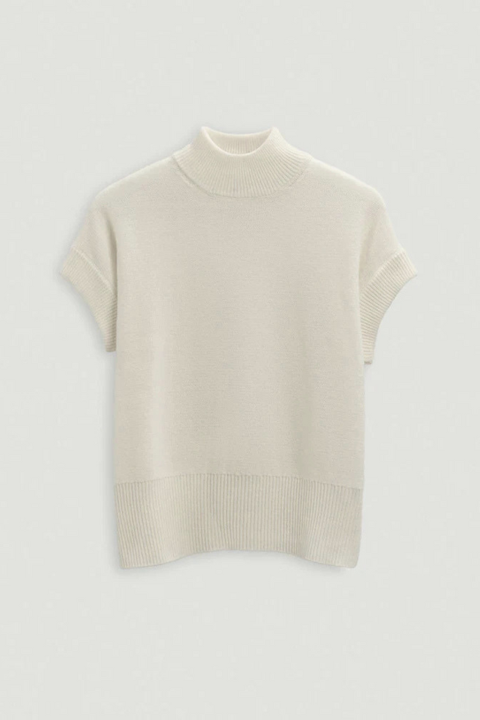 Beige turtleneck sweater on a light gray background. | Exclude | Grid