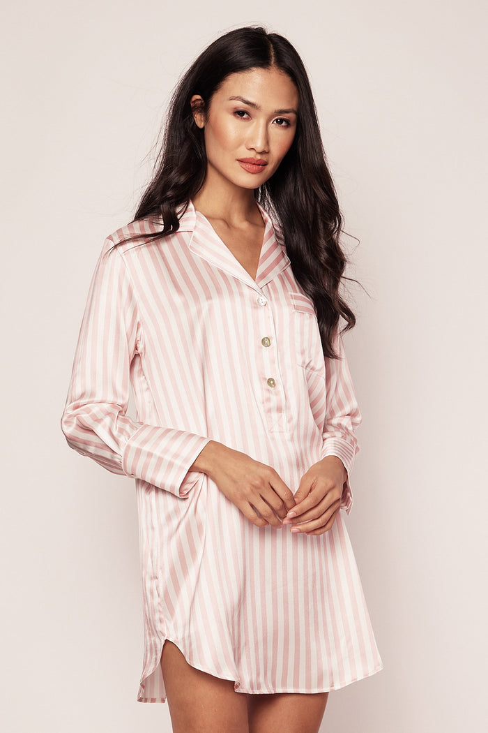 Woman wearing a pink striped satin nightshirt against a plain background | Grid Hover | Exclude