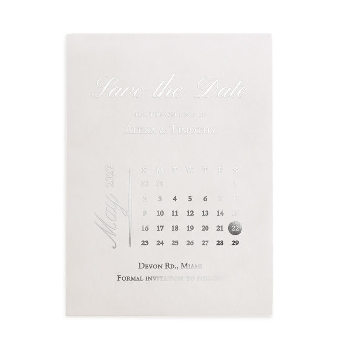 Vellum “Save the Date” wedding card with delicate white calligraphy, minimalist layout, surrounded by blooming white florals and soft sunlight – XOXOKristen