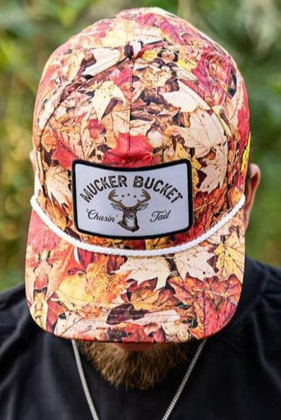 mucker bucket - chasin' tail fall camo bucket hat on model