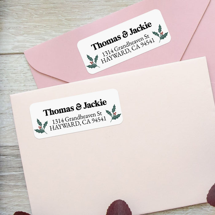 Close-up of holly berry return address label featuring traditional green leaves and red berries with bold black font - XOXOKristen