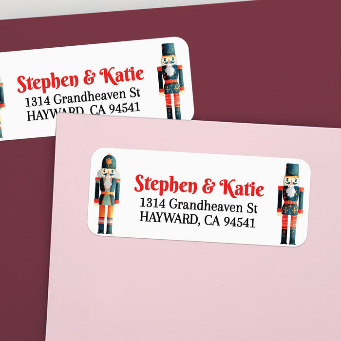Custom nutcracker return address labels on pink and burgundy envelopes, featuring Christmas soldier design and elegant printed text - XOXOKristen