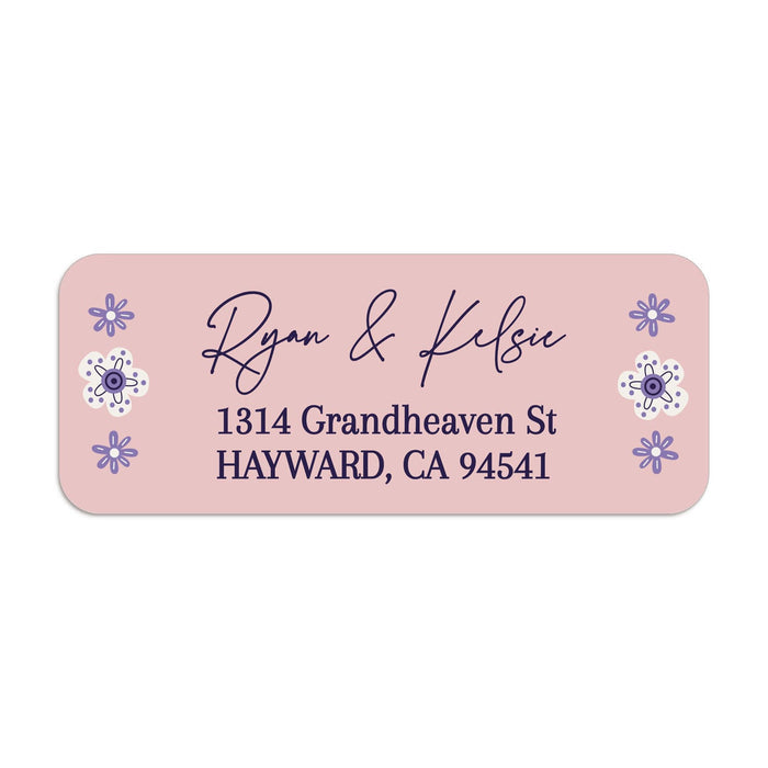 Close-up of pink floral return address label with whimsical purple flower illustrations and stylish handwritten typography - XOXOKristen
