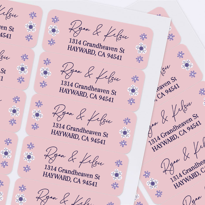 Sheet of personalized pink return address labels with floral accents and modern script font, perfect for weddings, parties, and everyday mailing - XOXOKristen