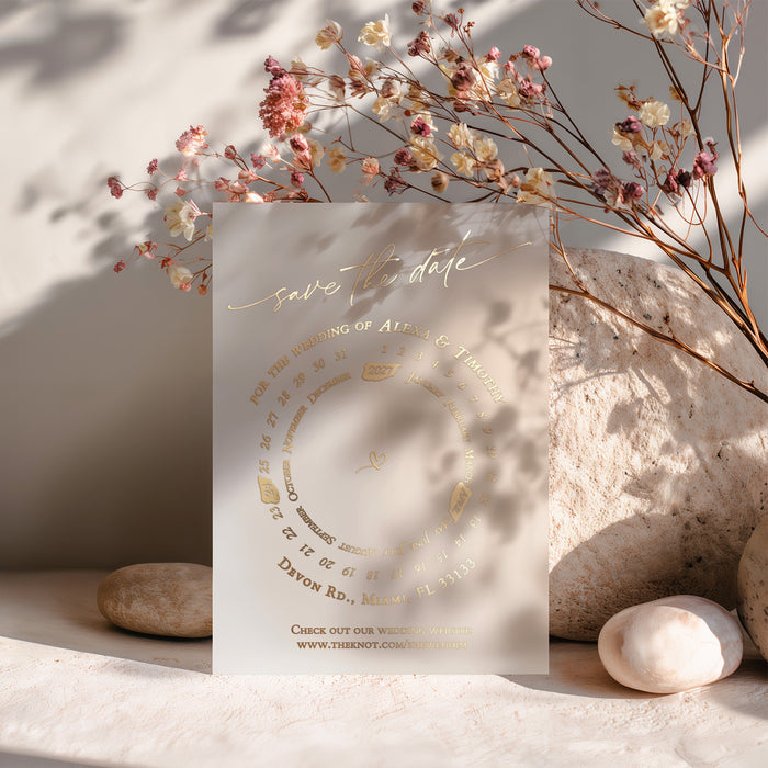 Gold-foiled vellum Save the Date card styled among dried florals and neutral tones, perfect for romantic weddings – XOXOKristen