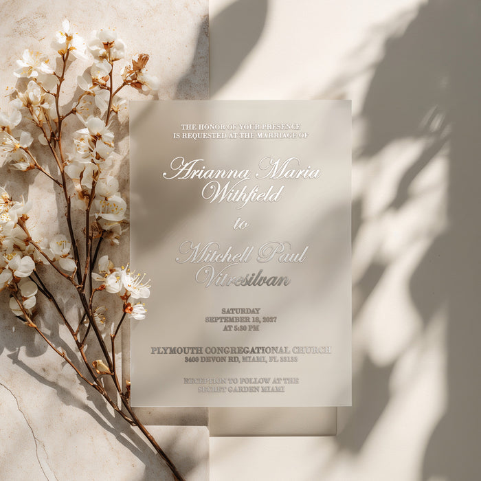 translucent vellum wedding invitation with silver ink printed text, styled with blooming white flowers and natural shadows over a soft beige background, minimalist and romantic wedding stationery design for elegant celebrations – XOXOKristen