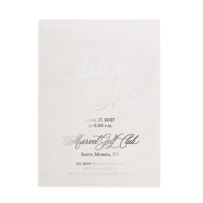 Elegant silver-foil vellum invitation displayed under natural light with floral stems and soft shadows, perfect for luxury wedding stationery mockups – XOXOKristen.